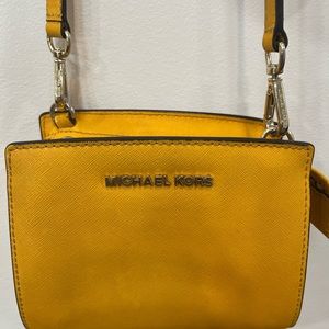 Michael Kors yellow small handbag.